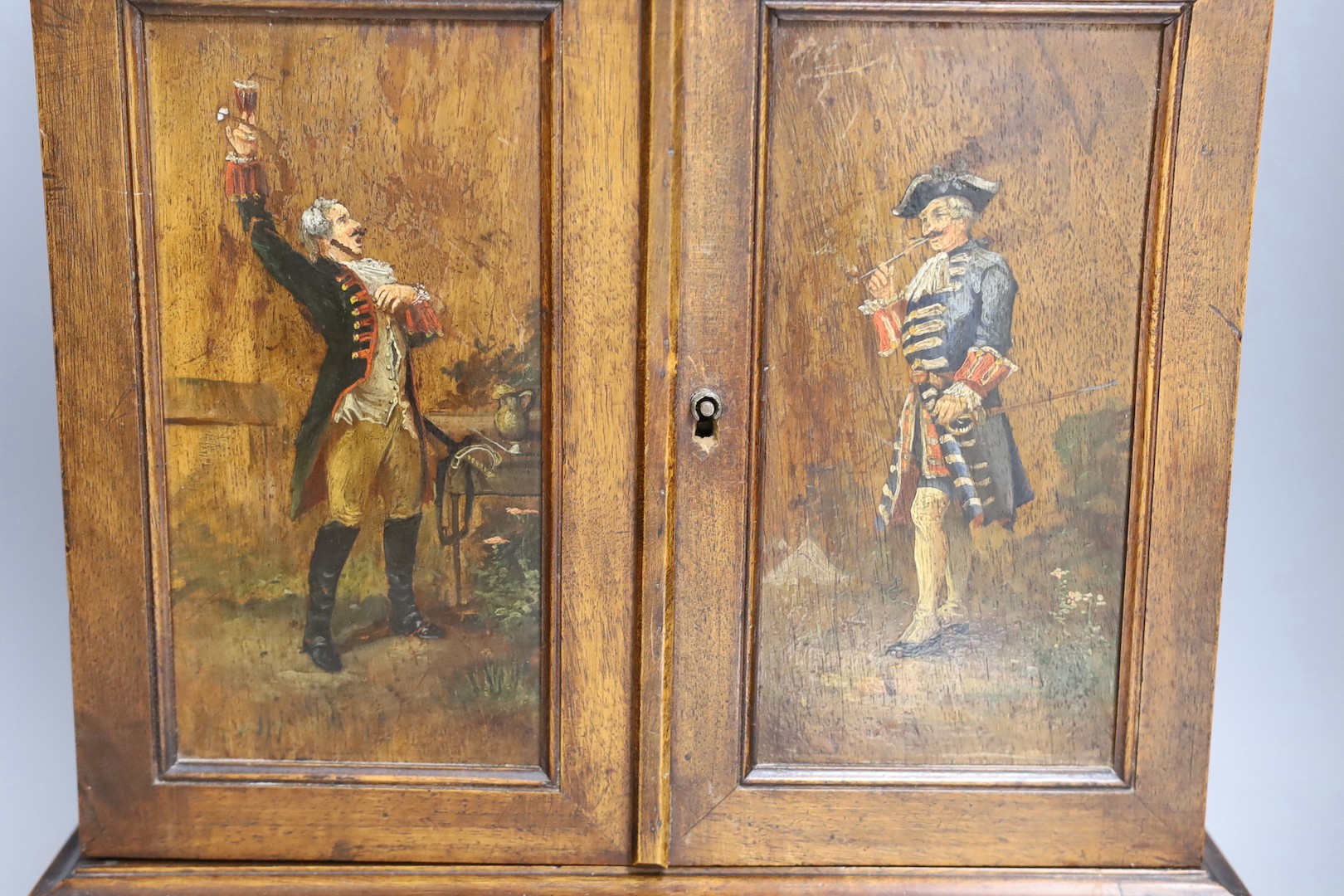 A 19th century walnut cigar cabinet, with an ivory and bone gallery., 6 cms wide x 45 cms high.